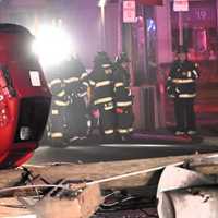 <p>Christian Pilamunga Pilco is interviewed by Bergenfield police after being treated by EMS following the Dec. 27 overnight crash on South Washington Avenue.
  
</p>