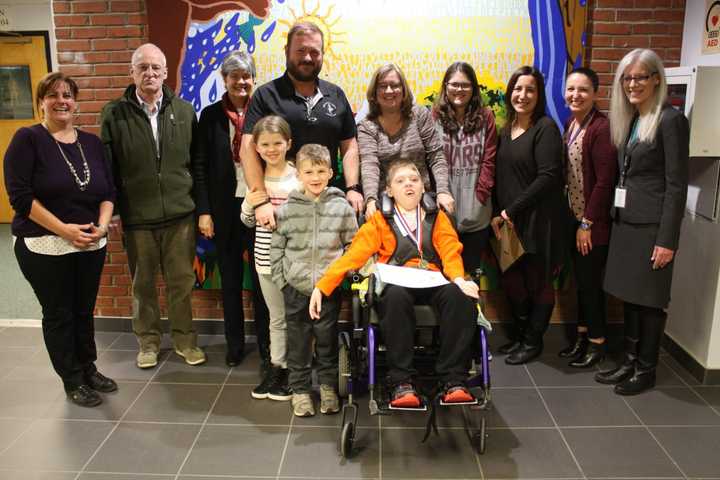 Spencer Oram with his family and BOCES educators.