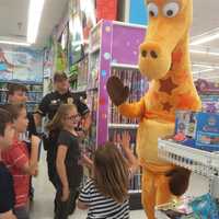 <p>Emerson children who won a &quot;Shop with a Cop&quot; shopping spree were greeted by Geoffrey at Toys &quot;R&quot; Us in Paramus.</p>