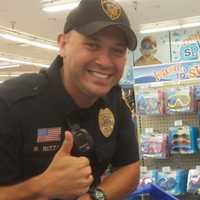 <p>Emerson Officer Brendan Rizza has a great time shopping with the children from the get-go.</p>