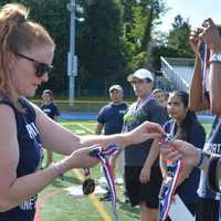 <p>Jeanne Browne gives out medals.</p>