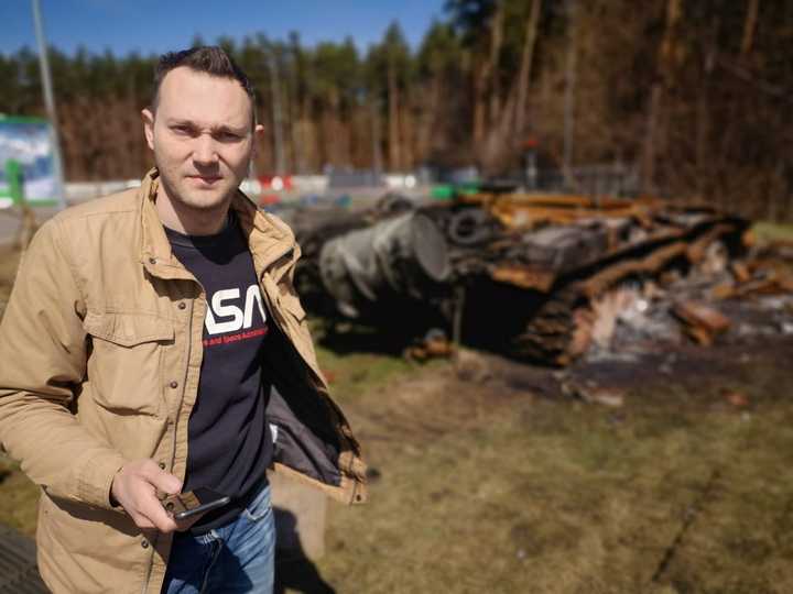 Volodymyr Mula. stands in a nearby city in Kiev after Russian forces bombed the area.