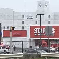 <p>Hackensack firefighters tending to the smoky HVAC unit on top of the Staples store.</p>