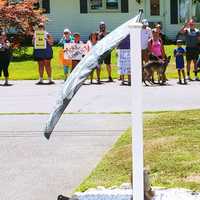 <p>Protesters gather outside Michelle Galbraith&#x27;s home following the alleged incident of her son calling a Black football player a racial slur</p>