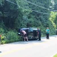 Driver, Passenger Treated By Paramedics After BMW SUV Rolls Over In Area