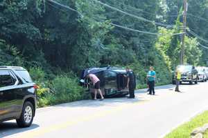 Driver, Passenger Treated By Paramedics After BMW SUV Rolls Over In Area