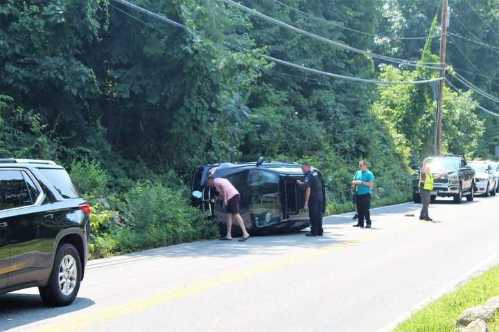 Driver, Passenger Treated By Paramedics After BMW SUV Rolls Over In Area