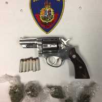 Suspect Charged After Cops Find Gun On Roof During Raid In Stamford
