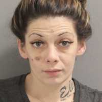 Woman, Two Men Charged After 22 Unregistered Firearms, Drugs Seized At Long Island Residence