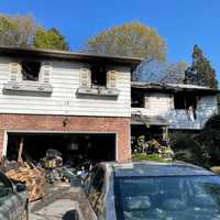 <p>A woman was rescued by fast-acting first responders in Nassau County when a massive house fire gutted a Searington home.</p>