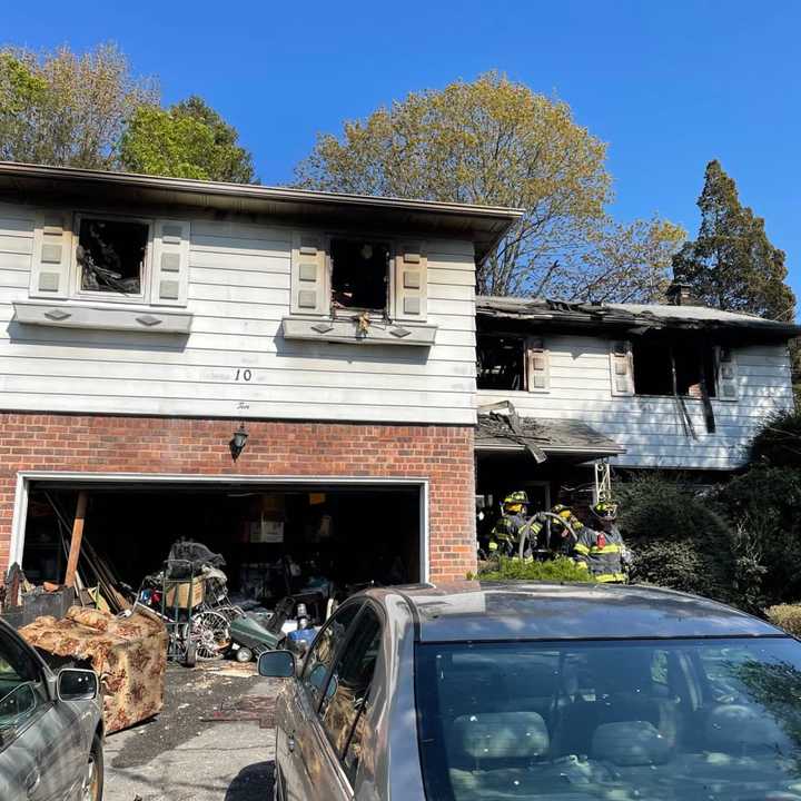 A woman was rescued by fast-acting first responders in Nassau County when a massive house fire gutted a Searington home.