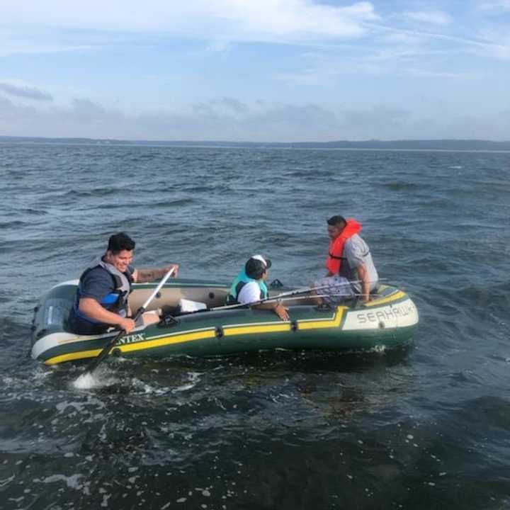 Three were rescued from a raft in the Long Island Sound.