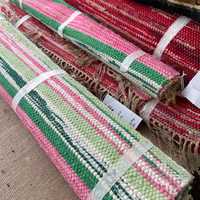 <p>Rolled up, a grouping of colorful braided rugs were moved from Stewart’s tag sale to the auction
gallery.</p>