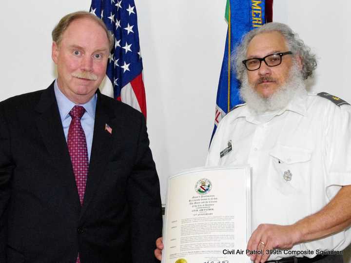 State Sen. Michael McLachlan (left) presents 399th Composite Squadron Commander Maj. Joseph Bisnov (right) with a commemorative proclamation from the city of Danbury in recognition of Civil Air Patrol&#x27;s 75th Anniversary.