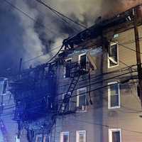 <p>A huge chunk of the 91 Street Apartments in Garfield collapsed in the fire.</p>