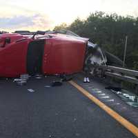 <p>The driver of a tractor-trailer that rolled over was not injured.</p>