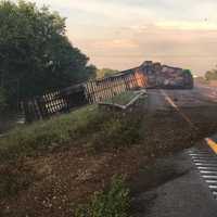 <p>A tractor-trailer driver lost control of his vehicle and rolled over on I-84.</p>