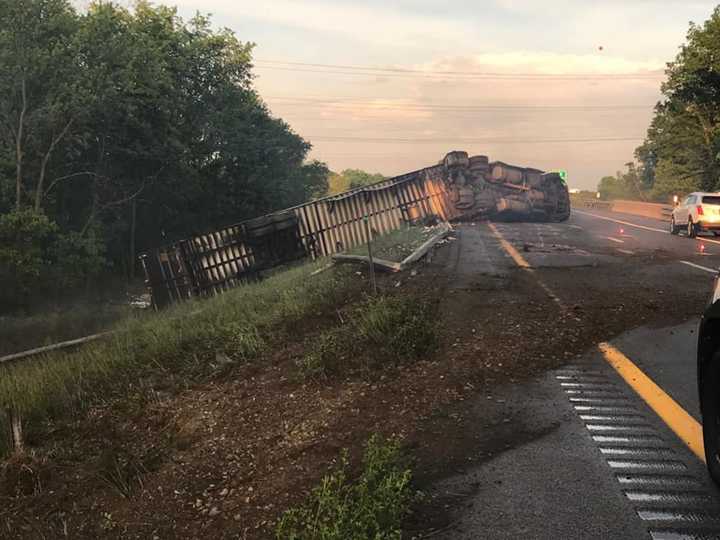 A tractor-trailer driver lost control of his vehicle and rolled over on I-84.