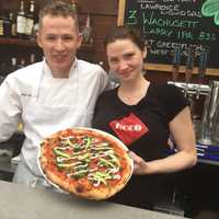 <p>Showing off the signature brick oven pizza at ECCO Eatery in Bethel.</p>