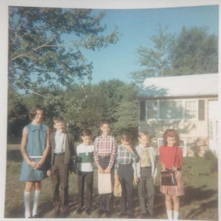 Waiting for the bus: (from left) Karen McLaughlin, Roger McLaughlin, Billy Patterson, Charlie Bobbins, Michael Bobbins, John Fenyo and Carol Anne Velarde.