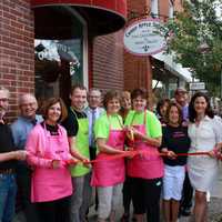 <p>Lauren Brophy and Leigh Petroski cut the ribbon at the Warwick location.</p>