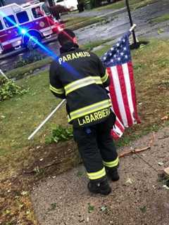 Resident: Paramus Firefighter Raises Fallen Stars And Stripes During Storm