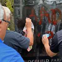 <p>Ridgefield Park&#x27;s finest clean the graffiti from the memorial.</p>