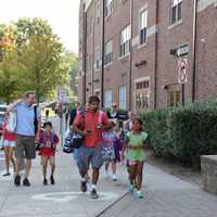 <p>Bronxville parents and students walking to the first day of school.</p>