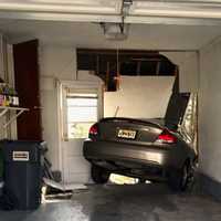 Bergenfield Driver Plows Older-Model Sedan Through Garage Wall