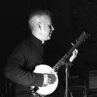 <p>Joe Oriente strums his banjo at a Dads Night Band performance in Ridgewood.</p>