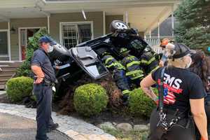 Photos: Vehicle Overturns After Crashing Into House In Rockland