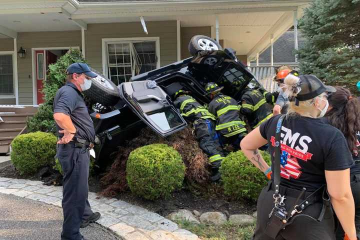 Photos: Vehicle Overturns After Crashing Into House In Area