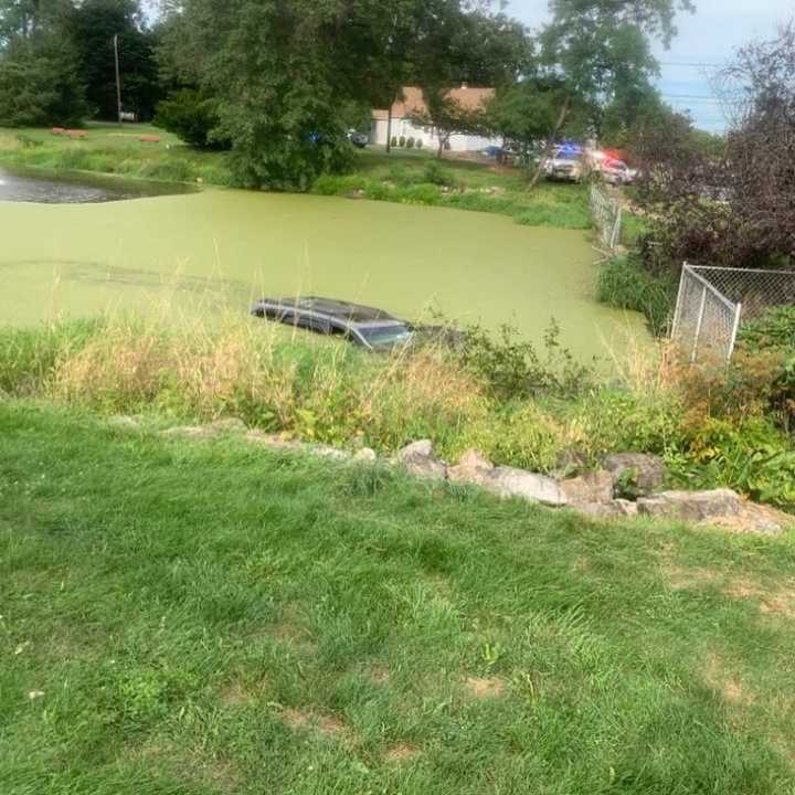 The driver&#x27;s car submerged in the Ardmaer Park pond.