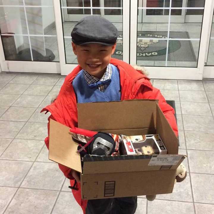 Lukas Kwon with his &quot;Star Wars&quot; prize at the Oakland Public Library.