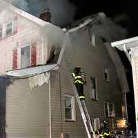 <p>Flames ran up the walls to the roof and attic.</p>