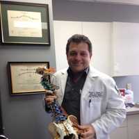 <p>Double board-certified osteopathic physician David Abend in his Oradell office.</p>