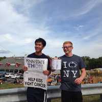 <p>Pennsylvania State University sophomores Tyler Staffin, right, and Mickey Sangteerasintop, raise money for pediatric cancer outside of Demarest Farms on Saturday, in Hillsdale.</p>