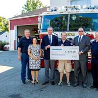 <p>Capacity Coverage presents a check to the Mahwah Fire Department for new equipment.</p>