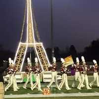 <p>The band marches at twilight during the competition.</p>