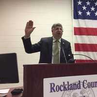 <p>Rockland County Clerk Paul Piperato swears in 100 new U.S. citizens during a ceremony.</p>