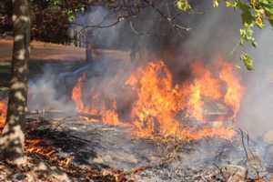 Firefighter Pulls Unconcious Person From Burning Car At Cemetery In Area