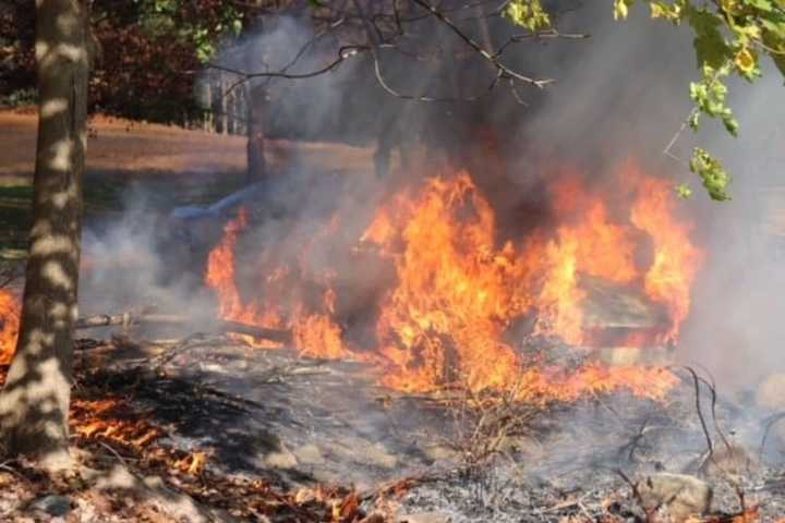 Firefighter Pulls Unconcious Person From Burning Car At Cemetery In Area