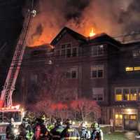 <p>Firefighters battle a raging fire at a condo complex at 100 Richards Ave. in Norwalk early Monday evening.</p>