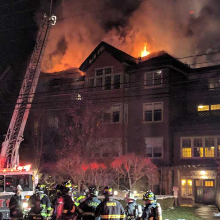 Firefighters battle a raging fire at a condo complex at 100 Richards Ave. in Norwalk early Monday evening.