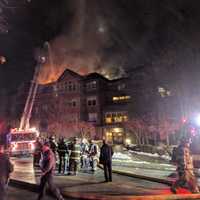 <p>Firefighters from Norwalk, Rowayton, Darien and Stamford battle a raging blaze at a condo complex at 100 Richards Ave. in Norwalk early Monday evening.</p>