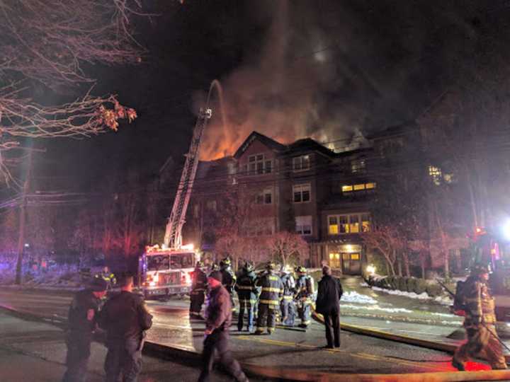 Firefighters from Norwalk, Rowayton, Darien and Stamford battle a raging blaze at a condo complex at 100 Richards Ave. in Norwalk early Monday evening.