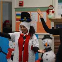 <p>Pre-kindergarten and kindergarten students enjoyed hearing the book &quot;Snowmen at Night&quot; read aloud while watching adults act out the story.</p>