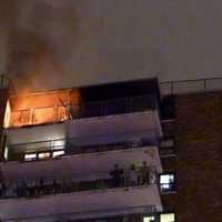 <p>Residents stood on their balconies to avoid possible smoke inhalation.</p>