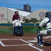 <p>Former U.S. President George H.W. Bush throws out the ceremonial first pitch to Don Bosco graduate Andrew Herrera.</p>