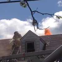 <p>Flames blew through the roof.</p>